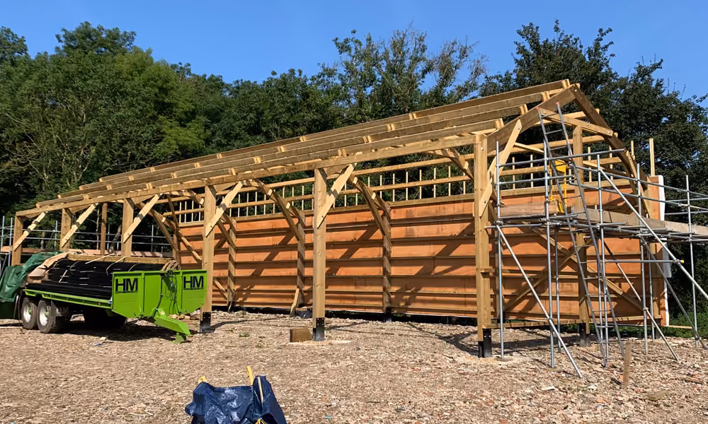Timber barn construction in progress, stage 5