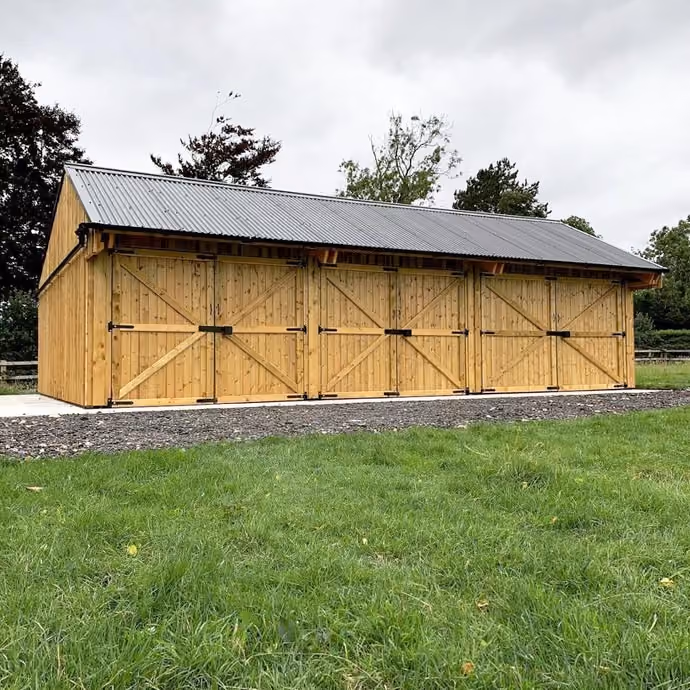 Timber-framed machinery storage shed